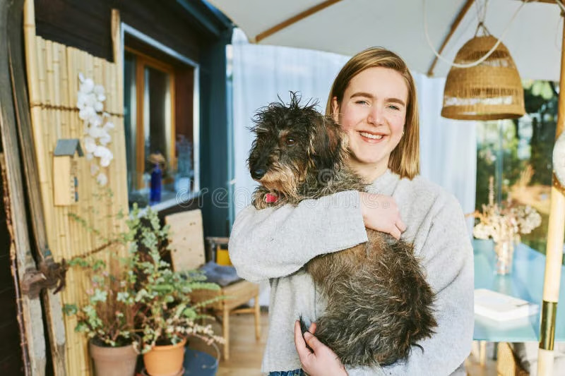 Woman at home with her dog